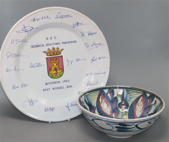 A pottery bowl decorated with stylised flowers in pink, blue and green (signed to base) and a large Talavera presentation charger